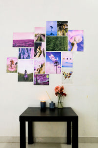 aesthetic lavender set of posters on a wall over a black coffee table