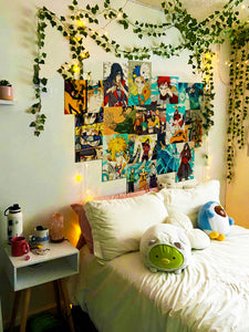 Naruto Shippuden anime collage posters on a bedroom wall with vines & string lights
