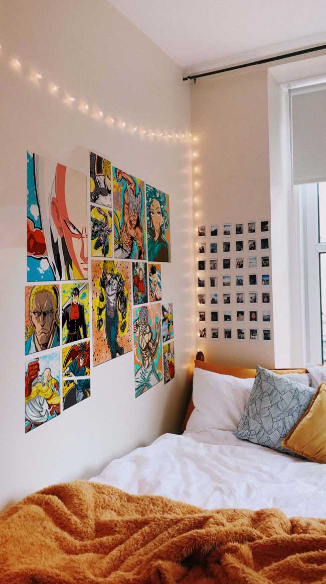 One Punch Man anime posters on a wall next to a bed with string lights