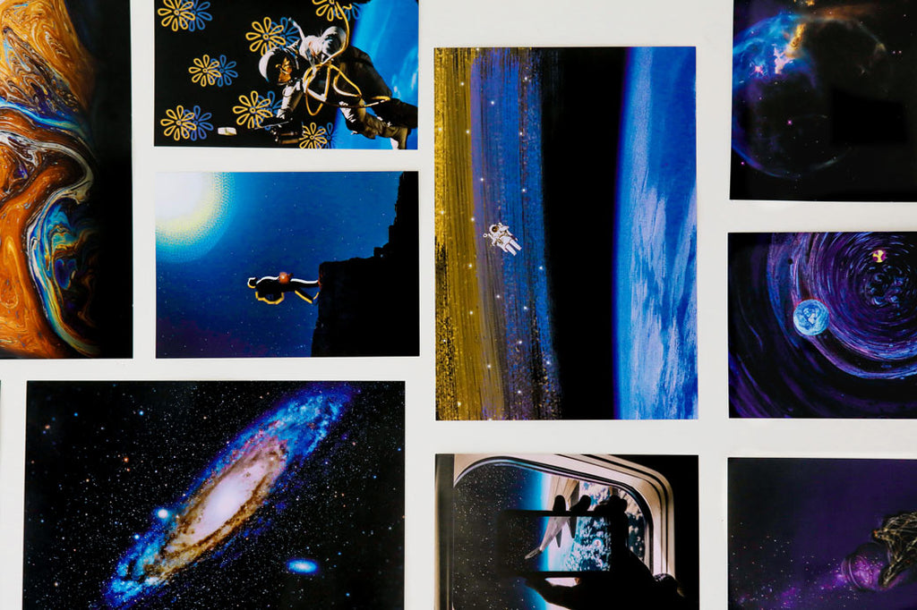 Posters of the galaxy, astronaut and planets on a wall