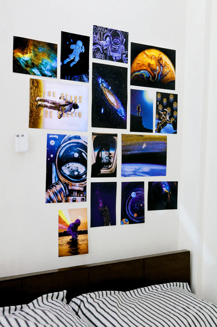mini kit posters of the galaxy, astronaut and planets on a wall