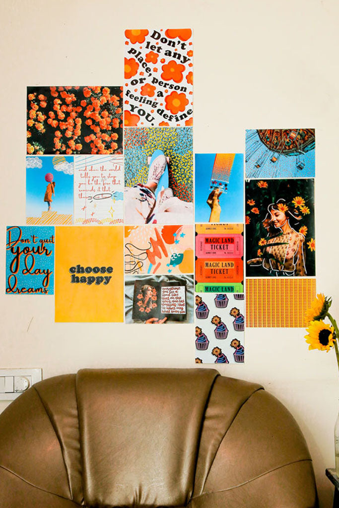 colorful doodled mini kit posters on wall over a dark brown couch