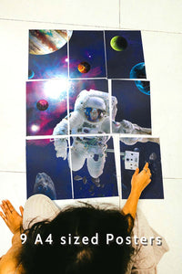 girl sitting with spaced out astronaut block kit 9 A4 set posters on the floor