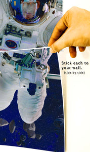 sticking astronaut A4 posters with tape on the wall